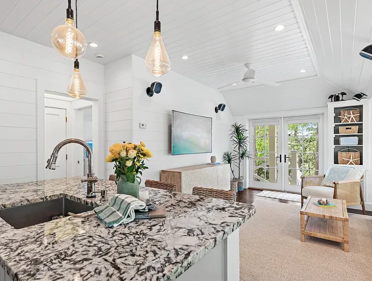 Living, dining, and the doors to the trees
